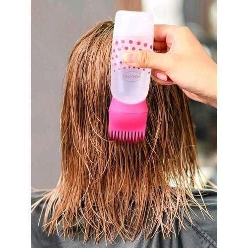 Diffuseur d'huile et applicateur de shampoing avec peigne colorant