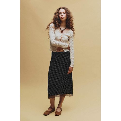 Jupe crayon mi-longue en tissu froissé à pois taille normale