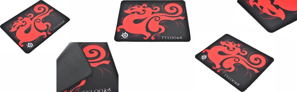 Multiple black gaming mousepads with red spiral or circular design pattern scattered at various angles.