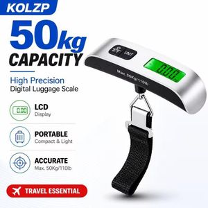 balance numérique de précision pour bagages de 110 lb/50 kg  Balance de voyage compacte et portable avec écran LCD rétroéclairé, poids facile à lire, tare automatique, Outil essentiel pour les voyageurs et les acheteurs + 2piles