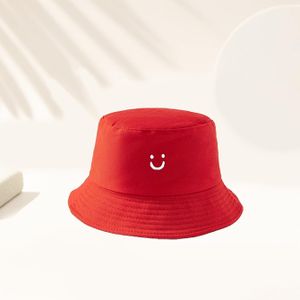 Bob unisexe de couleur unie avec imprimé "visage joyeux". Le nombre de lignes de surpiqûres sur le bord varie aléatoirement. Convient pour les voyages en plein air, les vacances à la plage, la solaire, la pêche et les tenues de campus. Fait également of