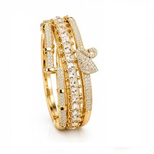 Luxory Lot de 3 Bracelets Rigides Dorés pour Femme - Motifs Clou, Pyramide et Cygne Sertis