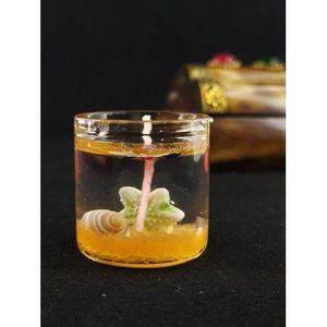 Bougie en gel décorée de coquillages, idéal pour une ambiance plage