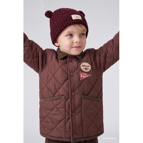 Bonnet avec oreilles et étiquette tissée pour bébé garçon