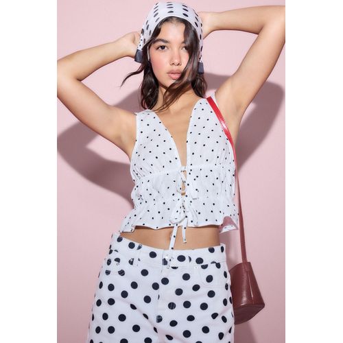 Blouse ajustée 100% coton blanche à pois à col V sans manches
